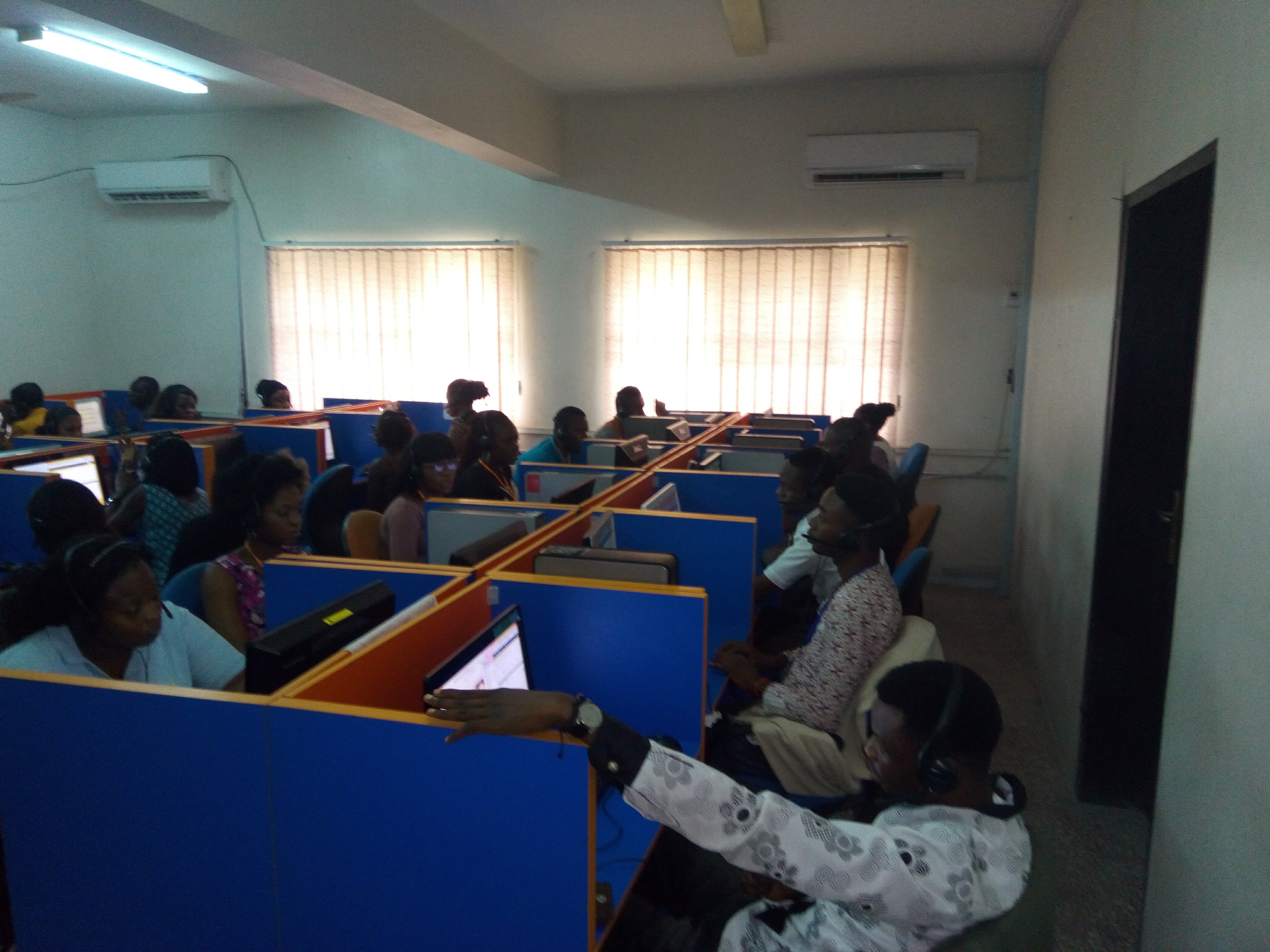CATI AFRICA call center agents working in a modern office environment conducting telephone surveys across Africa