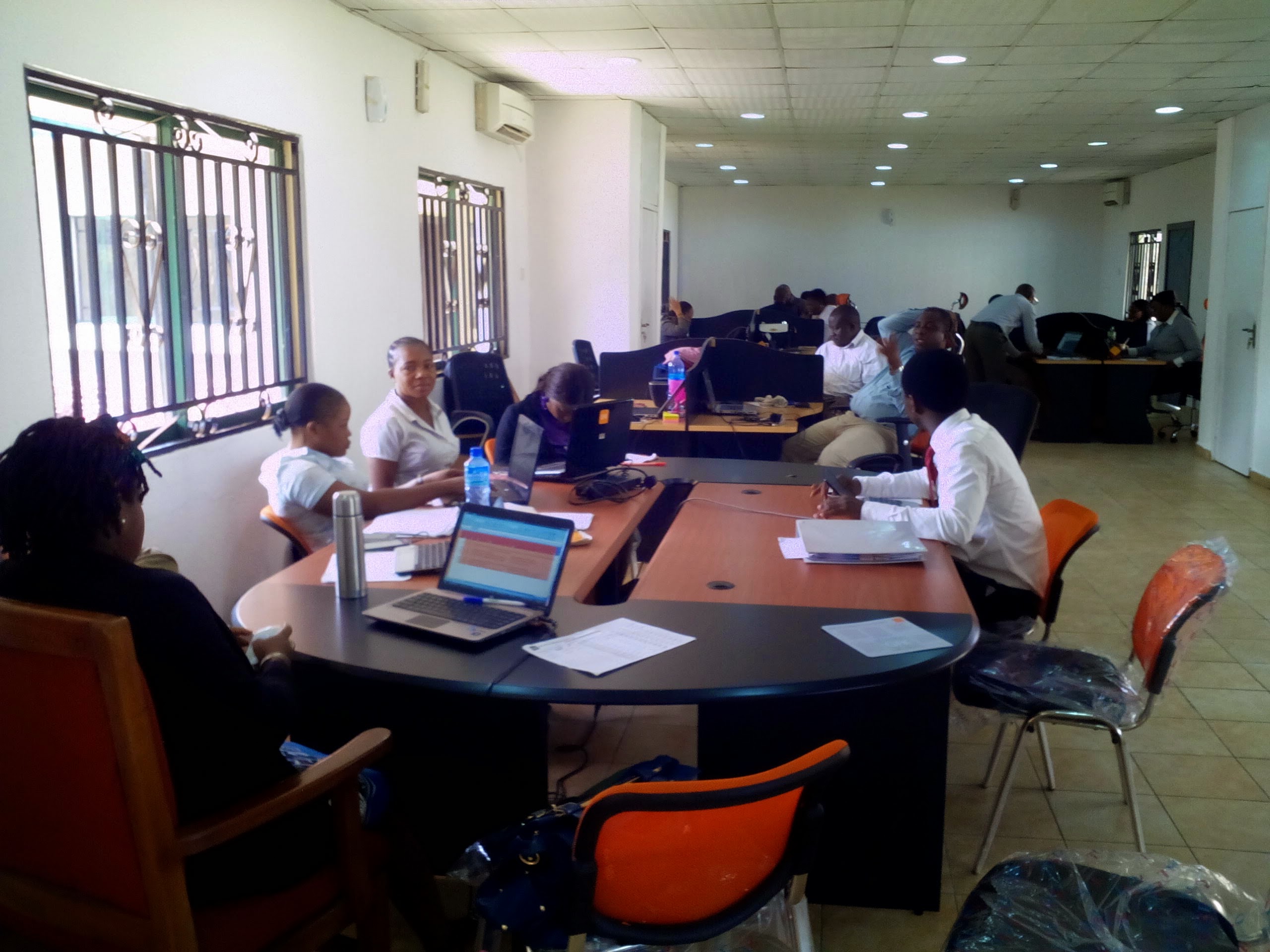 CATI call center operators conducting computer-assisted telephone interviews for data collection and market research