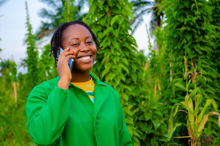 Woman using CATI to monitor climate change impact on vulnerable communities through telephone interviews