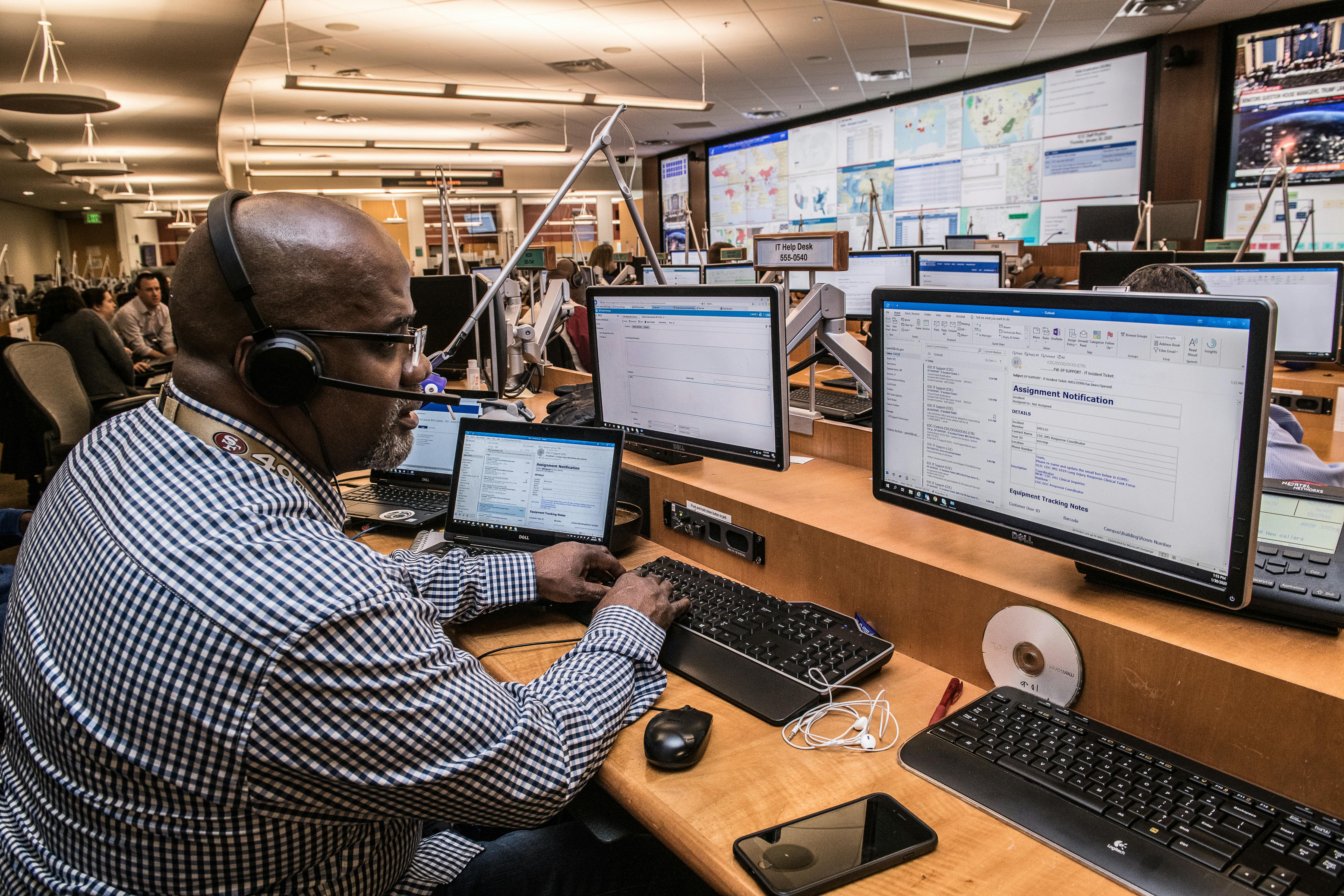 African man conducting a telephone survey using CATI software to gather real-time data in Africa.