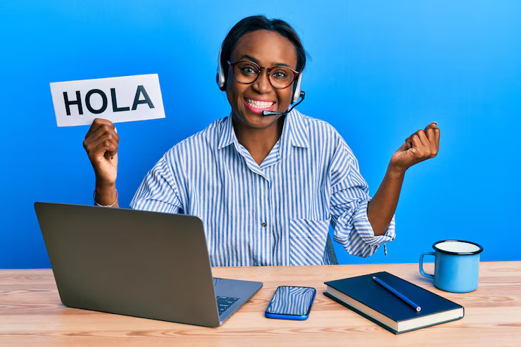 African interviewer conducting multilingual telephone surveys using headset and scripts.