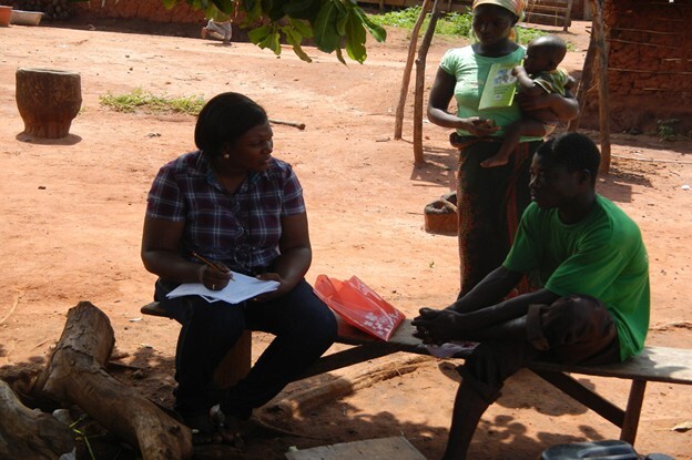 A local Interviewer collecting data on the field
