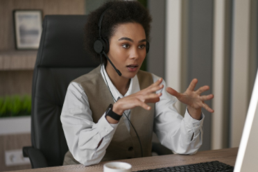 Researcher conducting a telephone survey with respondent to collect real human stories.