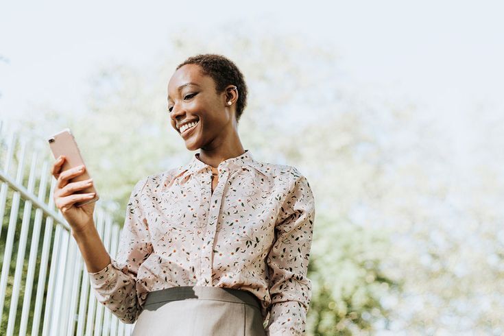 Kenyans using mobile phones for payments, communication, and digital services, reflecting the country’s high mobile phone penetration.