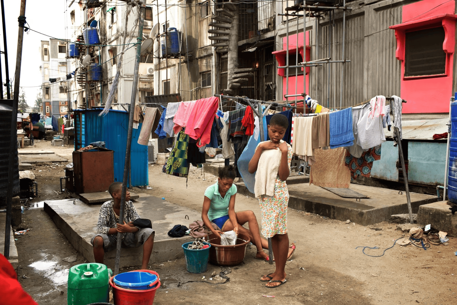 Nigerian family outside a modern suburban home
